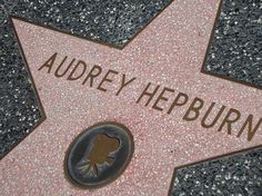 a star on the hollywood walk of fame with an inscription that reads, audrey heppurnn