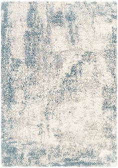 a white and blue rug with faded edges