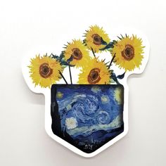 a vase filled with yellow sunflowers on top of a white wall