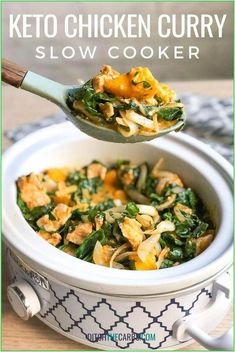 a close up of a spoon in a slow cooker filled with chicken and spinach