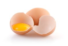 an egg is broken in half on a white background