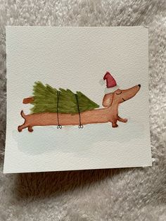 a watercolor drawing of a dachshund carrying a christmas tree on its back