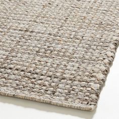 a close up view of a rug on a white surface with no one in it