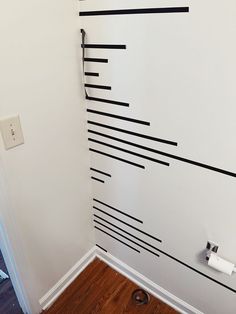 a white wall with black lines painted on it