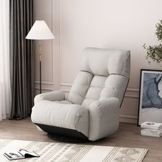 a recliner chair sitting in front of a lamp on top of a wooden floor