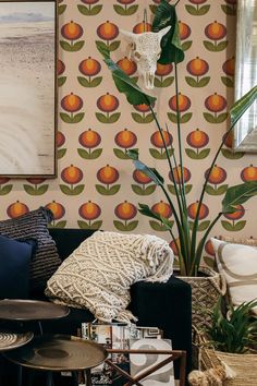 a living room filled with furniture and wallpaper