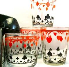 four glasses with hearts and spades on them