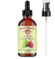 a bottle of grape seed oil next to a dropper