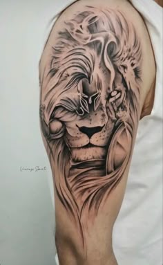 a man's arm with a lion tattoo on it, and his head is shown