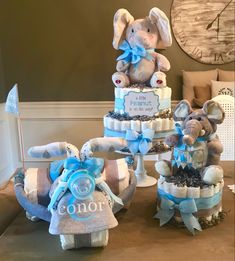 a baby shower cake made to look like an elephant with its trunk wrapped in diapers