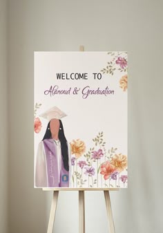 an easel with a sign on it that says, welcome to amanda and graduation