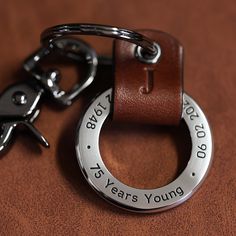 a keychain that says, you are one year young and has a ring on it