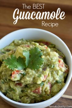 the best guacamole recipe is in a white bowl with cilantro on top