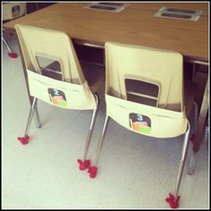 two chairs sitting on top of a wooden table