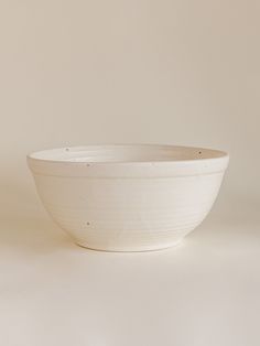 a white bowl sitting on top of a table