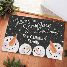 there's snowflake like home door mat with three snowmen on it