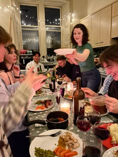 a group of people sitting around a table eating food