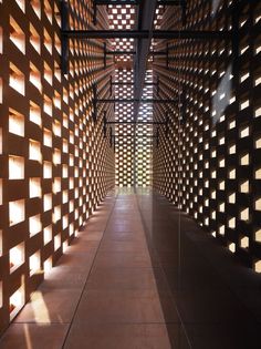 the inside of a building with wooden slats covering it's walls and floor