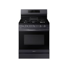 a black stove top oven with the door open on an isolated white background for use in commercial purposes