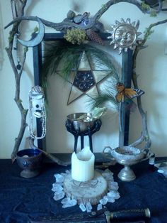 a table topped with candles and other items