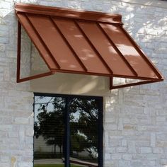 an awning on the side of a brick building