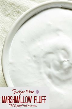 a bowl filled with marshmallow fluff sitting on top of a white towel