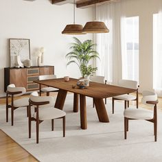 a dining room table with chairs and a potted plant in the center, on top of a white rug