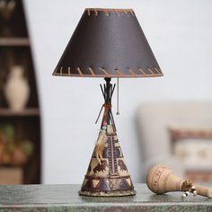 a lamp that is sitting on top of a table next to a bottle and cork