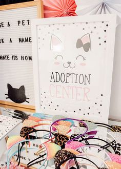 an assortment of hair accessories on display in front of a sign that says adoption center