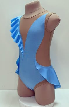 a mannequin wearing a blue leotard with ruffles on it