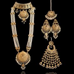 A set with the contemporary styling of traditional elements. If you want something exquisite and contemporary but also want to keep traditional feel alive, then our Mahra Set is the perfect choice! A beautiful set studded with kundan stones and adorned with black meenakari. Approximate mala length is 16.5". This bridal set includes a long mala paired with a choker, beautiful matching earrings and a maang teekah. Approximate earrings length is 3.5". This set is available in two options: Set with Rani Haar Gold, Heritage Jewellery, Pearl Necklace Designs, Gold Bridal Jewellery Sets, Indian Jewelry Sets, Pakistani Jewelry, Gold Fashion Necklace, India Jewelry, Bridal Jewellery Indian