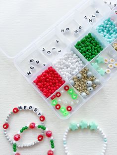 beaded bracelets and beads are arranged in a plastic container on a white surface