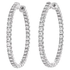 Circa 2005, 18k, by Tiffany & Co., New York. These chic diamond hoops by Tiffany & Co. are all about the diamonds! Set with 2.79 carats of brilliant white diamonds (G color VS clarity), the look is sparkling American girl glamour. At one and a half inches in diameter, they are proportioned perfectly for the ear and grab the attention of the eye tastefully. Excellent condition. Noted: Comes with an original Tiffany appraisal from 2011 Remark: "Tiffany quality, Tiffany Design …classic iconic style Tiffany And Co Earrings, Silver Round Earrings, Tiffany Diamond, Authentic Jewelry, Cubic Zirconia Earrings, Cz Earrings, Zirconia Earrings, Tiffany And Co, Earrings White