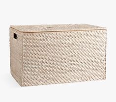 a white wicker storage box on a white background