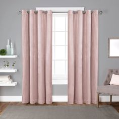 a living room with grey walls and pink curtains