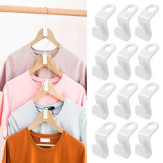 several shirts hanging on clothes hangers next to each other