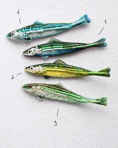 three different types of fishing lures on a white surface with numbers in the bottom right corner