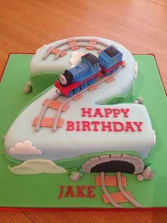 a birthday cake with a train on it