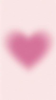 a heart shaped object on a pink background