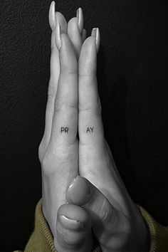 two hands with the words pray written on them