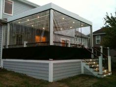 a house with a screened porch and stairs