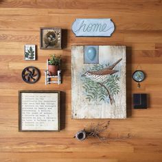 a wooden wall with various items on top of it and a sign that says home