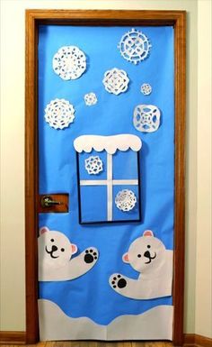 a polar bear classroom door decorated with paper snowflakes