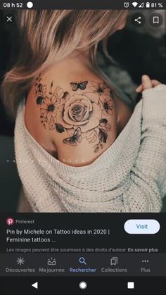 a woman with a flower tattoo on her upper back shoulder and shoulders is looking at the camera