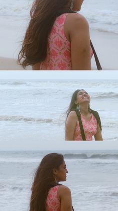 a woman standing on top of a beach next to the ocean and looking up at the sky