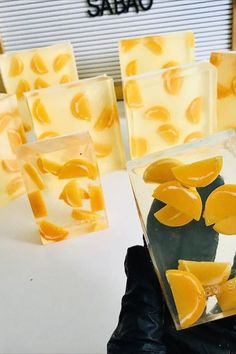 several pieces of yellow soap sitting on top of a white table next to each other