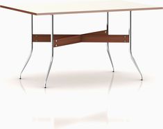 a white table with some metal legs and a brown wooden surface on the bottom half