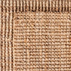 a close up view of the texture of a carpet with brown and tan colors on it