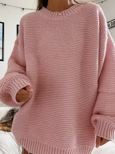 Chunky ribbed knit pullover sweater with a round neck and long sleeves. The cuffs and the neck line are both ribbed. The Model is 5'6 and is wearing a size medium Pink Fall Sweater With Ribbed Cuffs, Fall Pink Sweater With Ribbed Cuffs, Oversized Ribbed Crew Neck Cropped Sweater, Oversized Ribbed Cropped Sweater With Crew Neck, Cozy Pink Sweater With Ribbed Cuffs, Cozy Cropped Turtleneck Sweater With Ribbed Cuffs, Ribbed Acrylic Turtleneck Sweater, Trendy Ribbed Crew Neck Sweater, Trendy Knit Sweater With Ribbed Cuffs