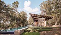 an outdoor pavilion in the middle of a forest